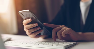 Hand using smartphone seo