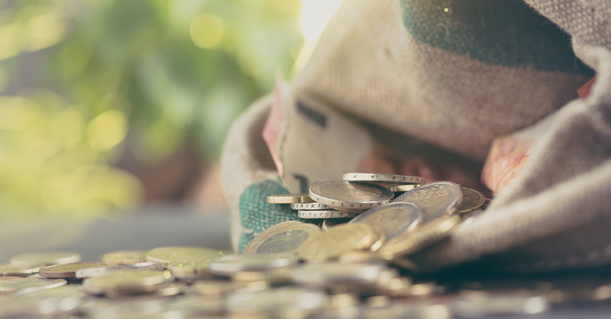 Saving money coins in bag pensions