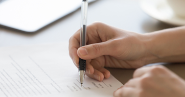 Hand signing legal document regulatory approval-LinkedIn