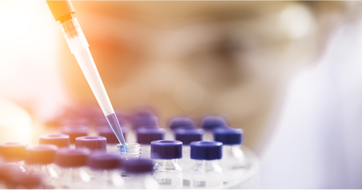 Female chemist with test tubes