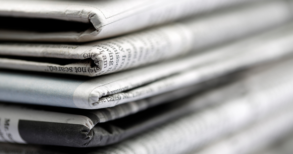 Newspapers folded and stacked SEO