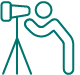 Person looking through a telescope